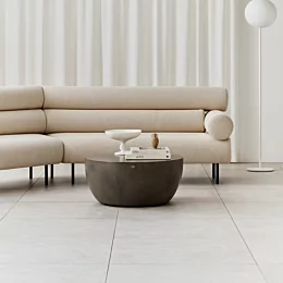 Blinde Design Curv 40 concrete coffee table centres a private residence living room, offering a sculptural round focal point for modern lounge style.